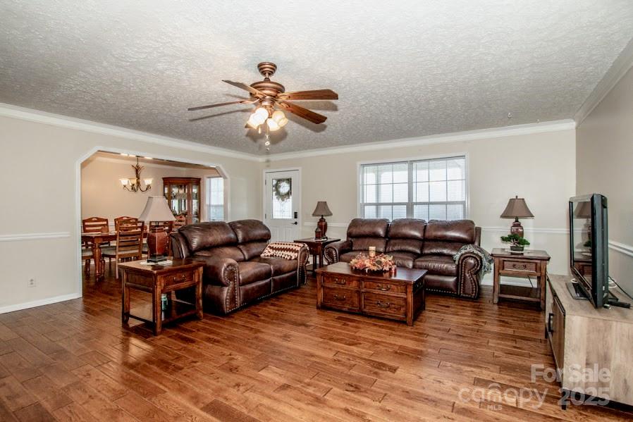 224 Stewart Rock Road Stony Point, NC 28678 - Photo 12 of 41 a living room with furniture and a flat screen tv