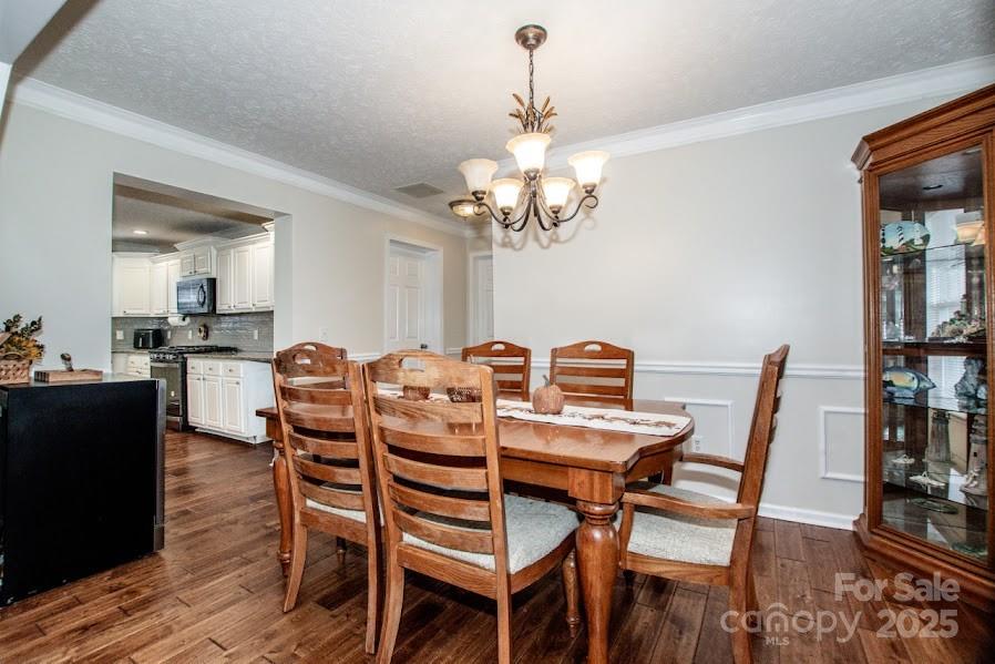224 Stewart Rock Road Stony Point, NC 28678 - Photo 13 of 41 a view of a dining room with furniture and wooden floor