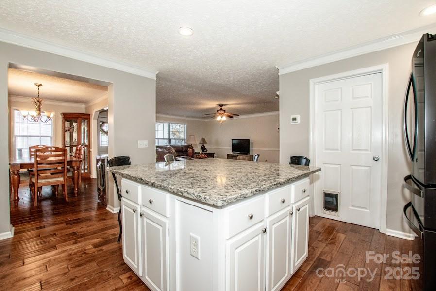 224 Stewart Rock Road Stony Point, NC 28678 - Photo 16 of 41 a kitchen with stainless steel appliances granite countertop a lot of counter space and wooden floor