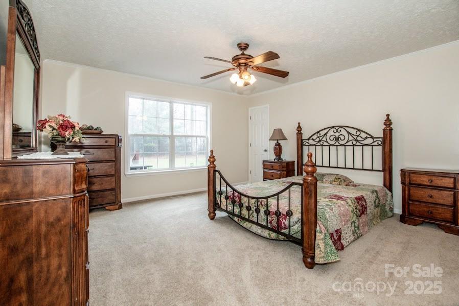 224 Stewart Rock Road Stony Point, NC 28678 - Photo 23 of 41 a bedroom with furniture and a window