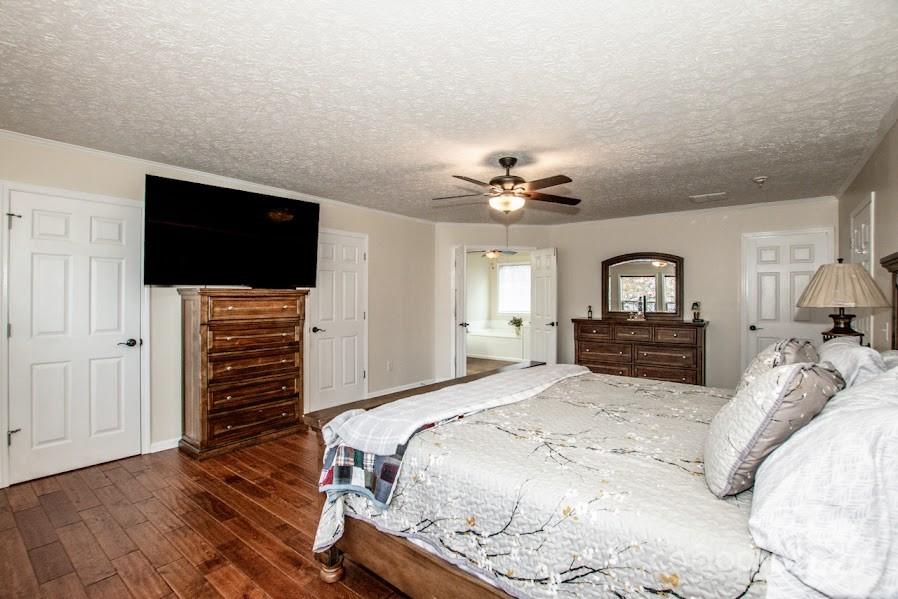 224 Stewart Rock Road Stony Point, NC 28678 - Photo 25 of 41 a spacious bedroom with a bed and a flat screen tv