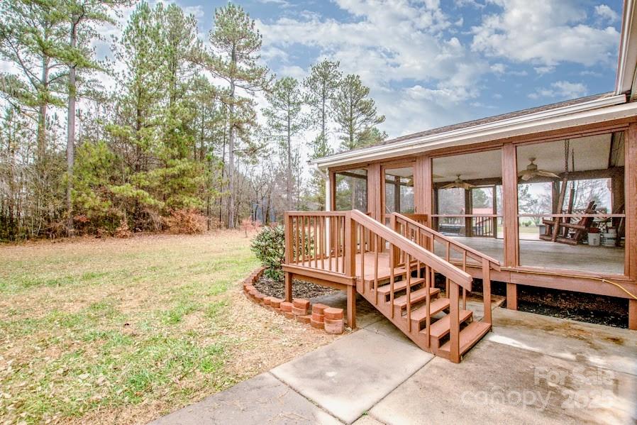 224 Stewart Rock Road Stony Point, NC 28678 - Photo 28 of 41 a view of a house with backyard and sitting area