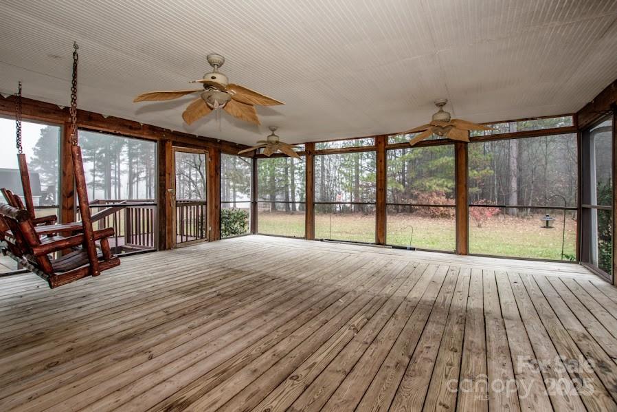 224 Stewart Rock Road Stony Point, NC 28678 - Photo 30 of 41 a view of an empty room with wooden floor and a window