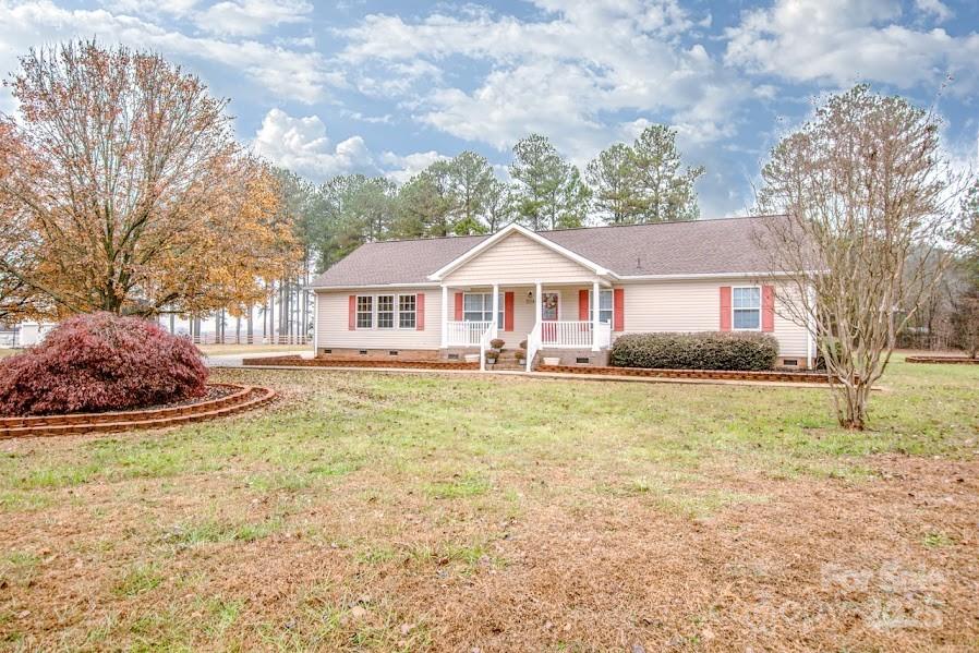 224 Stewart Rock Road Stony Point, NC 28678 - Photo 6 of 41 a front view of a house with garden