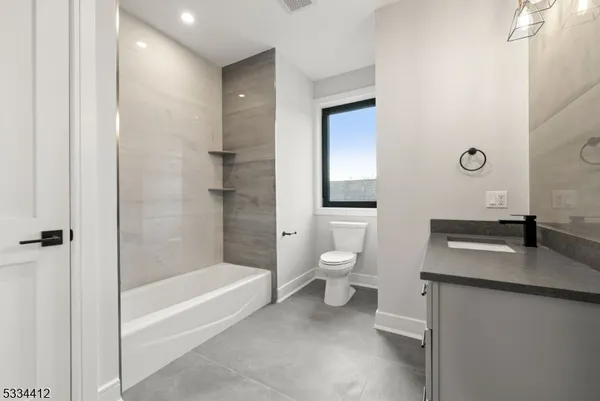 a bathroom with a sink and toilet