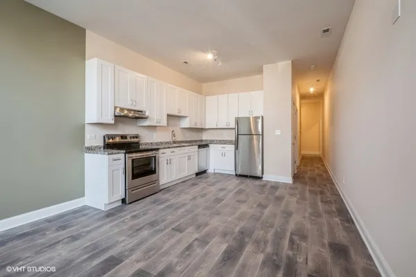 a view of kitchen with wooden floor