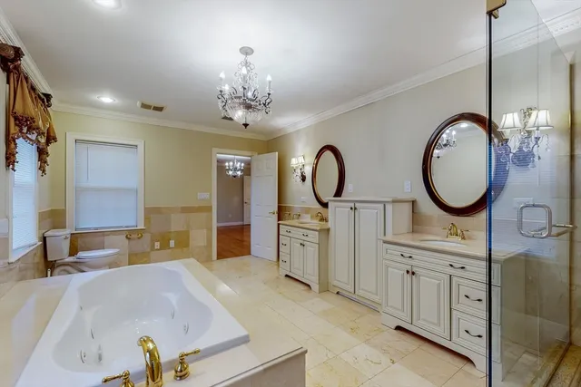 a spacious bathroom with a sink double vanity and a mirror