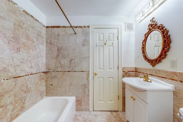 a bathroom with a sink and a bathtub