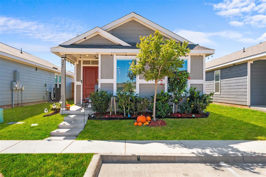 241 Thresher Lane Princeton, TX 75407 - Photo 1 of 33 a front view of a house with a yard and garage