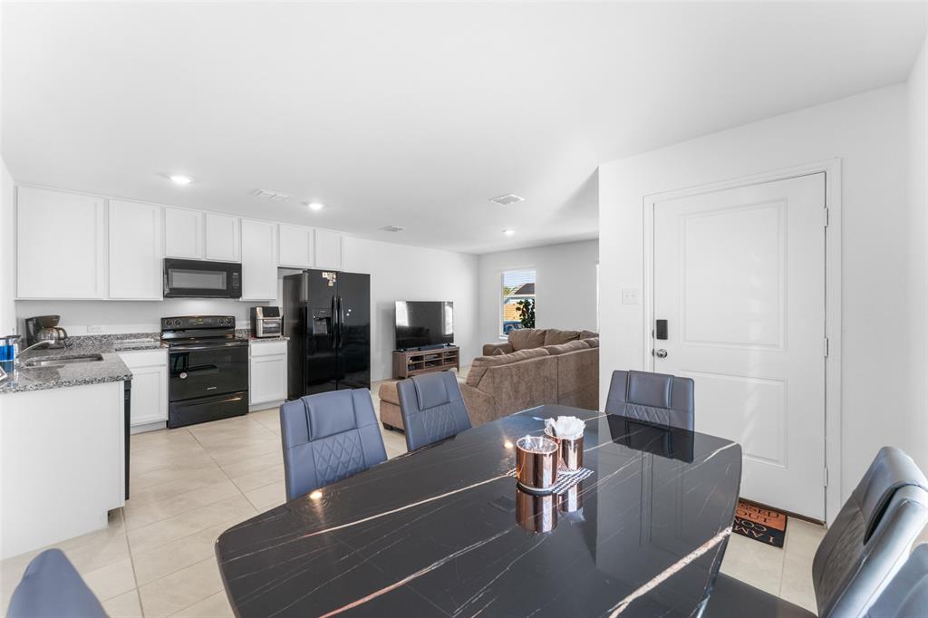 241 Thresher Lane Princeton, TX 75407 - Photo 12 of 33 a view of a dining room with furniture