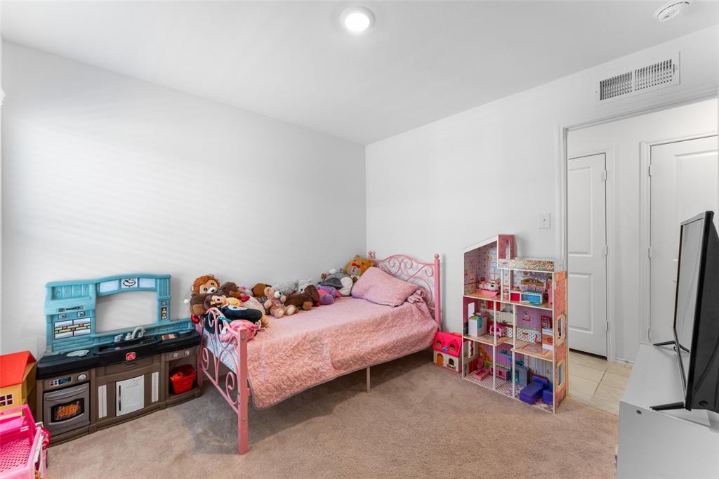 241 Thresher Lane Princeton, TX 75407 - Photo 20 of 33 a bedroom with furniture and a bed