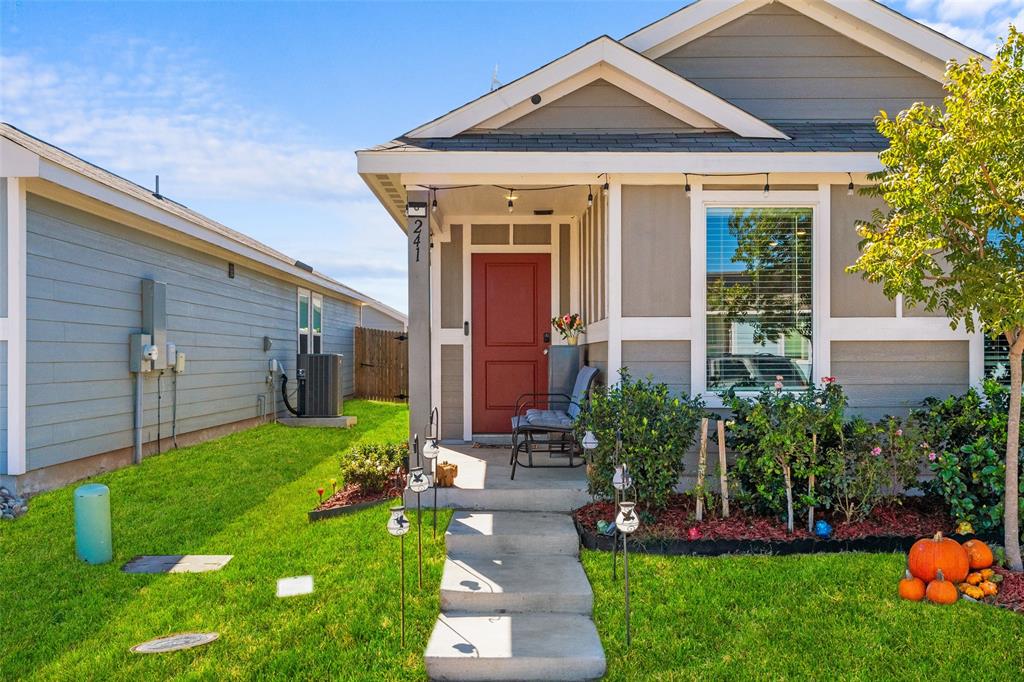 241 Thresher Lane Princeton, TX 75407 - Photo 2 of 33 a front view of a house with a yard and porch