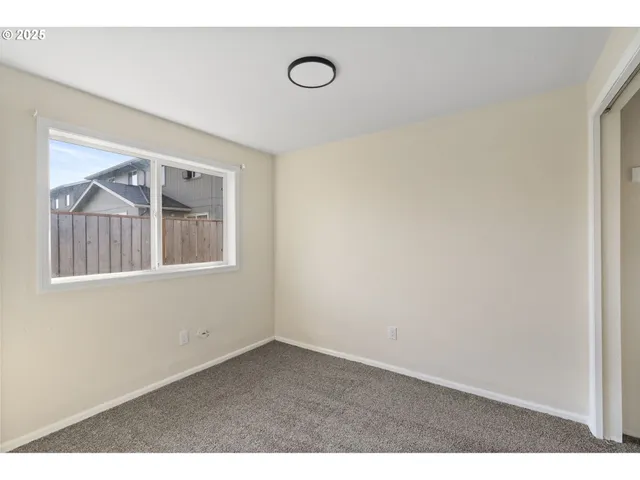 a view of empty room with windows