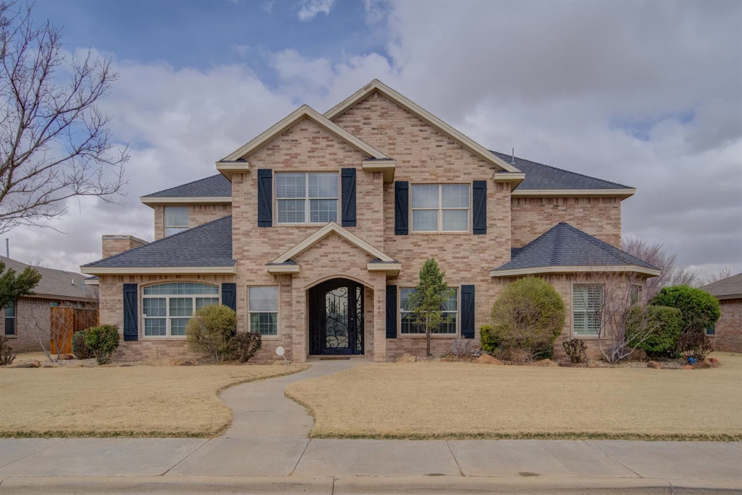5904 110th Street Lubbock, TX 79424 - Photo 1 of 50 front view of a house with a yard