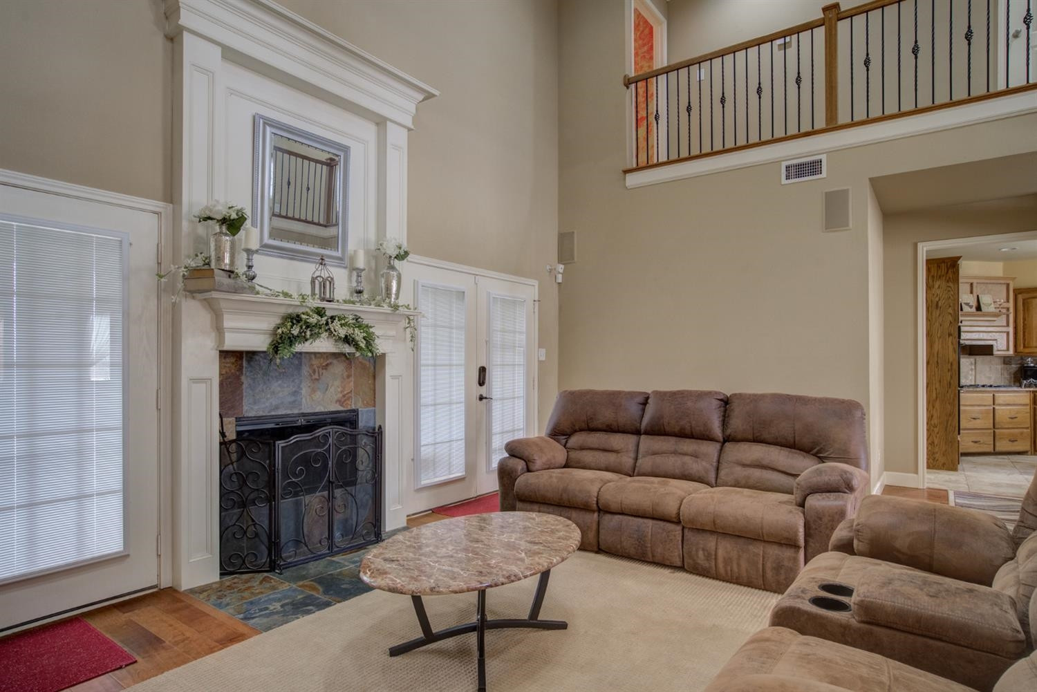5904 110th Street Lubbock, TX 79424 - Photo 11 of 50 a living room with furniture and a fireplace