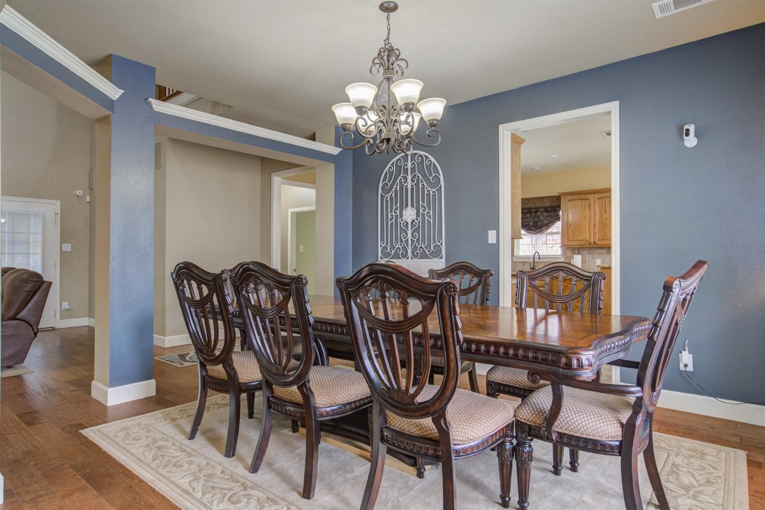 5904 110th Street Lubbock, TX 79424 - Photo 12 of 50 a view of a dining room with furniture and chandelier