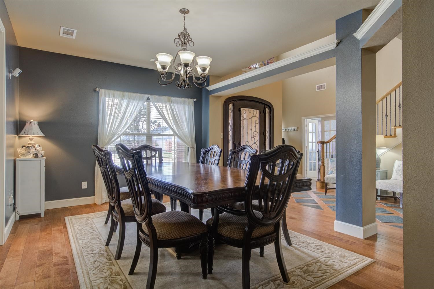 5904 110th Street Lubbock, TX 79424 - Photo 13 of 50 a view of a dining room with furniture window and wooden floor