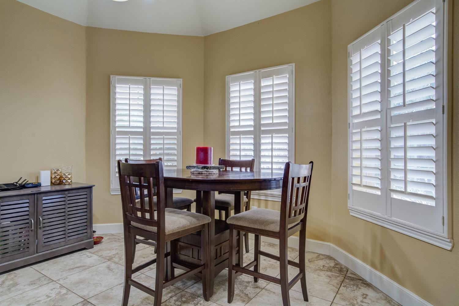 5904 110th Street Lubbock, TX 79424 - Photo 19 of 50 a view of a dining room with furniture and windows