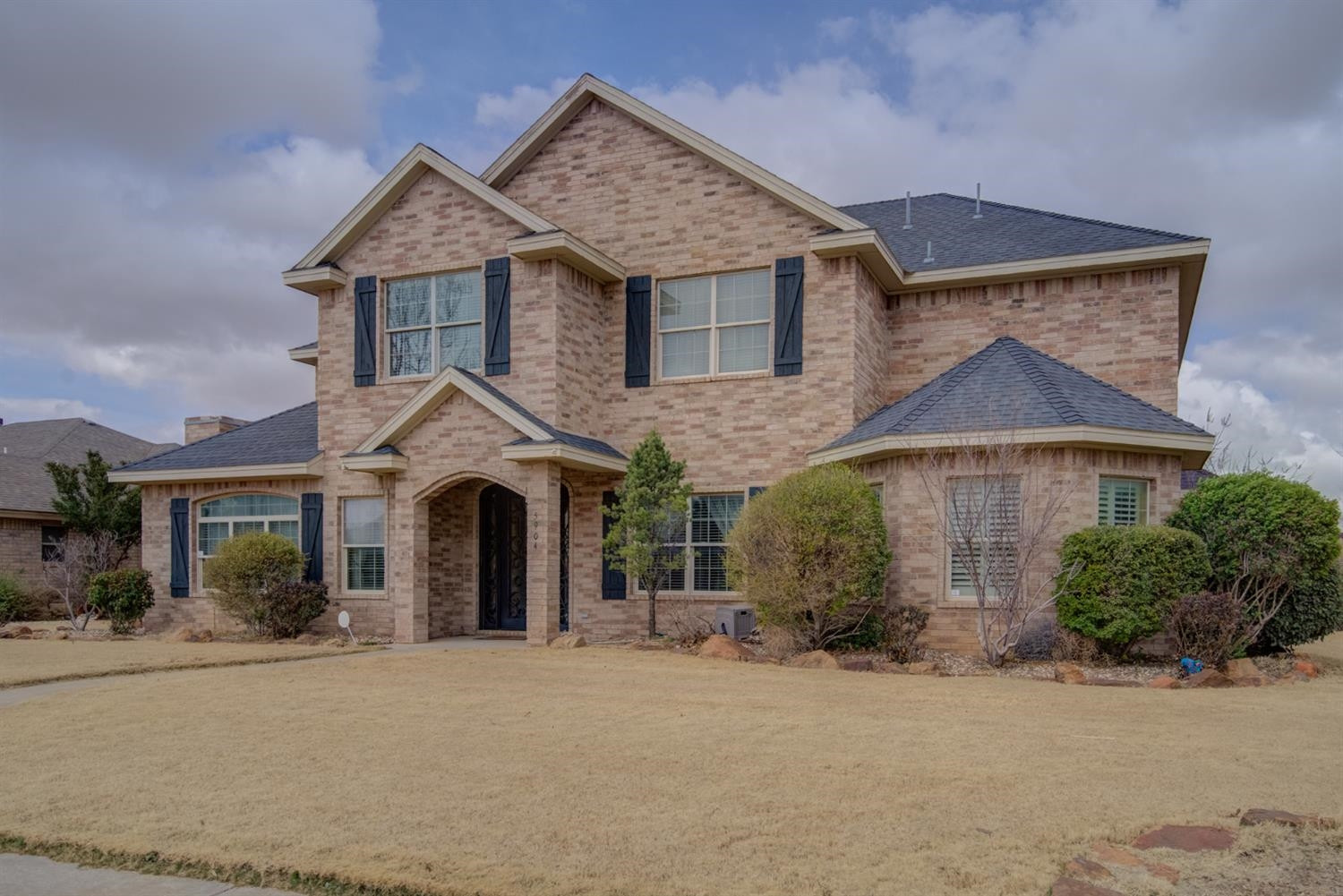 5904 110th Street Lubbock, TX 79424 - Photo 2 of 50 front view of a house with a yard
