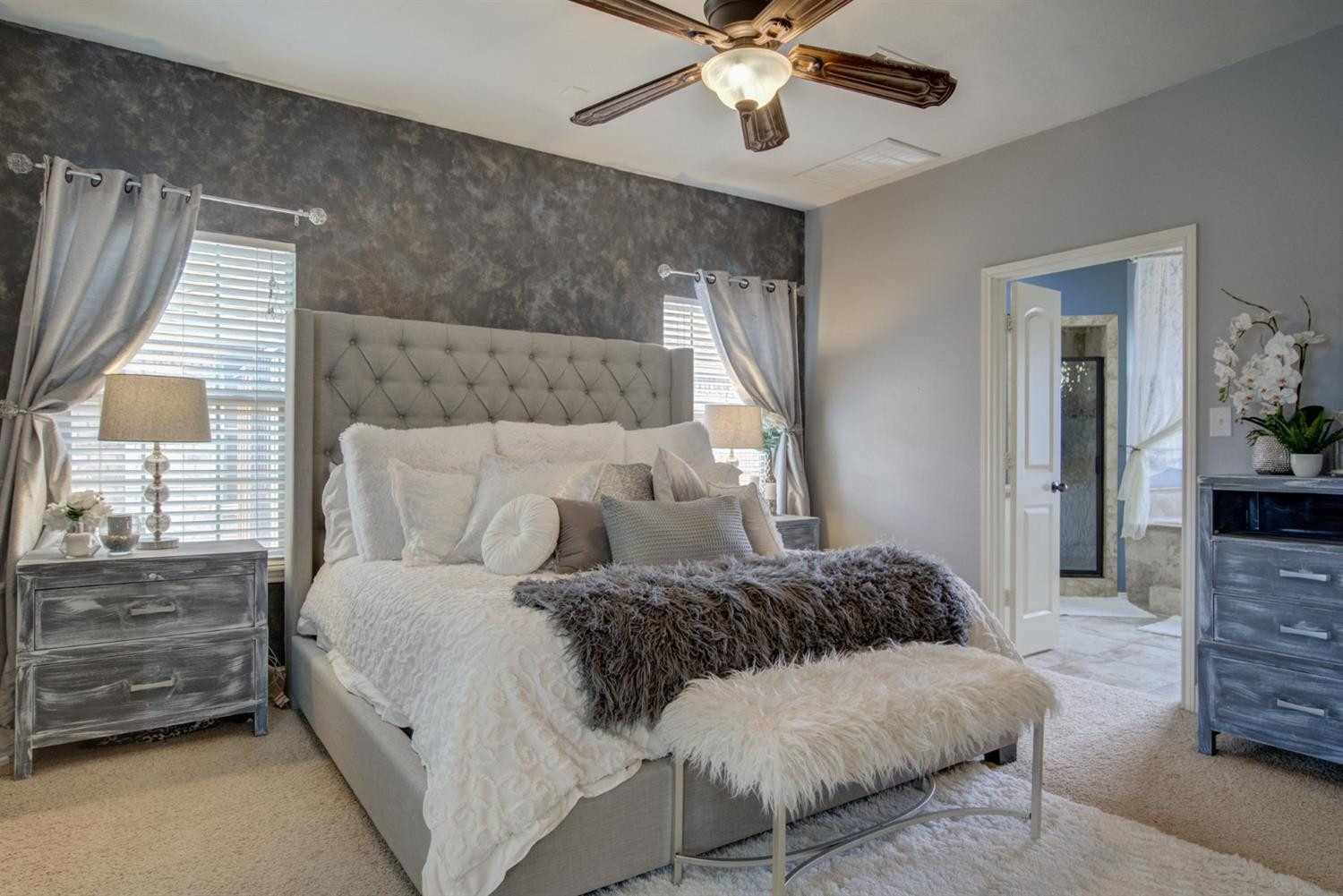 5904 110th Street Lubbock, TX 79424 - Photo 25 of 50 a bedroom with a bed chandelier and a window