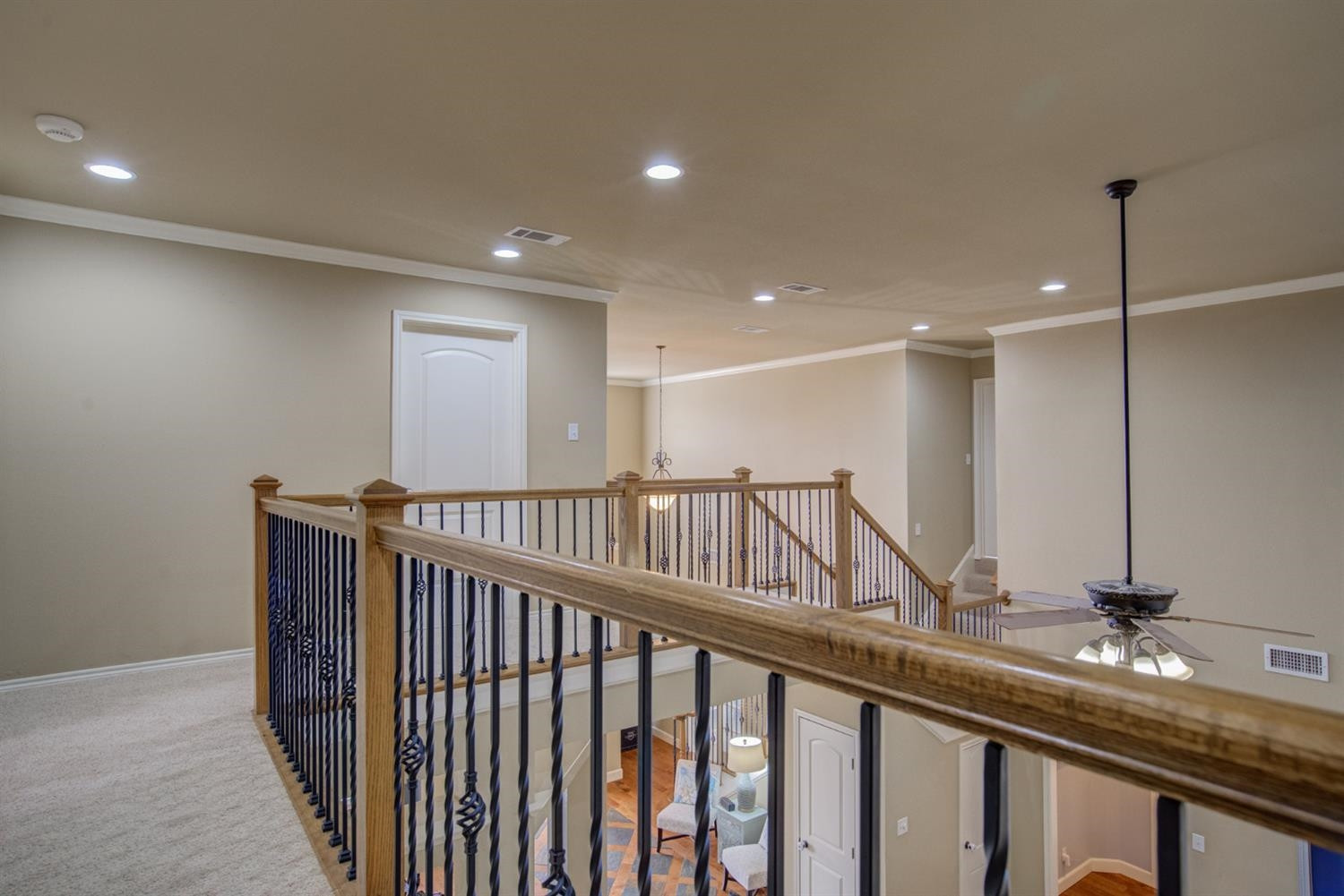 5904 110th Street Lubbock, TX 79424 - Photo 32 of 50 a view of a hallway with a large window and wooden floor
