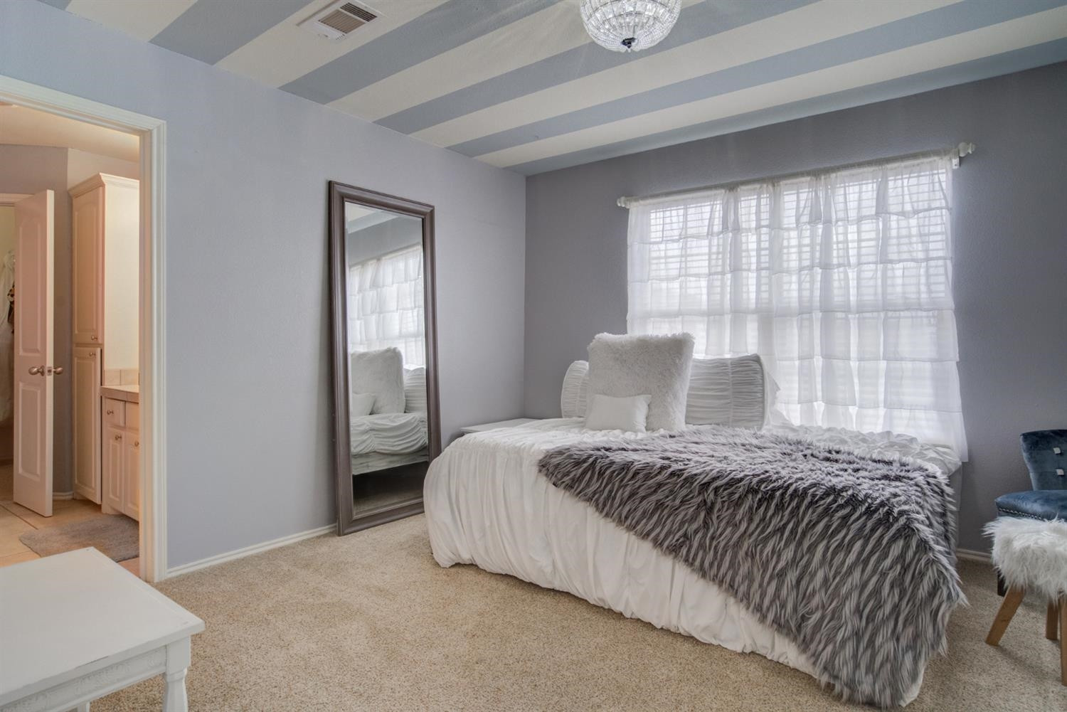 5904 110th Street Lubbock, TX 79424 - Photo 34 of 50 a bedroom with a bed and a window