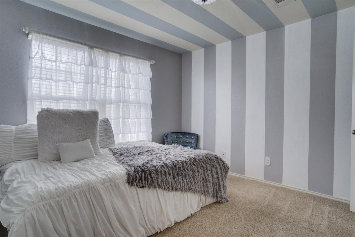5904 110th Street Lubbock, TX 79424 - Photo 35 of 50 a bedroom with a bed and a window