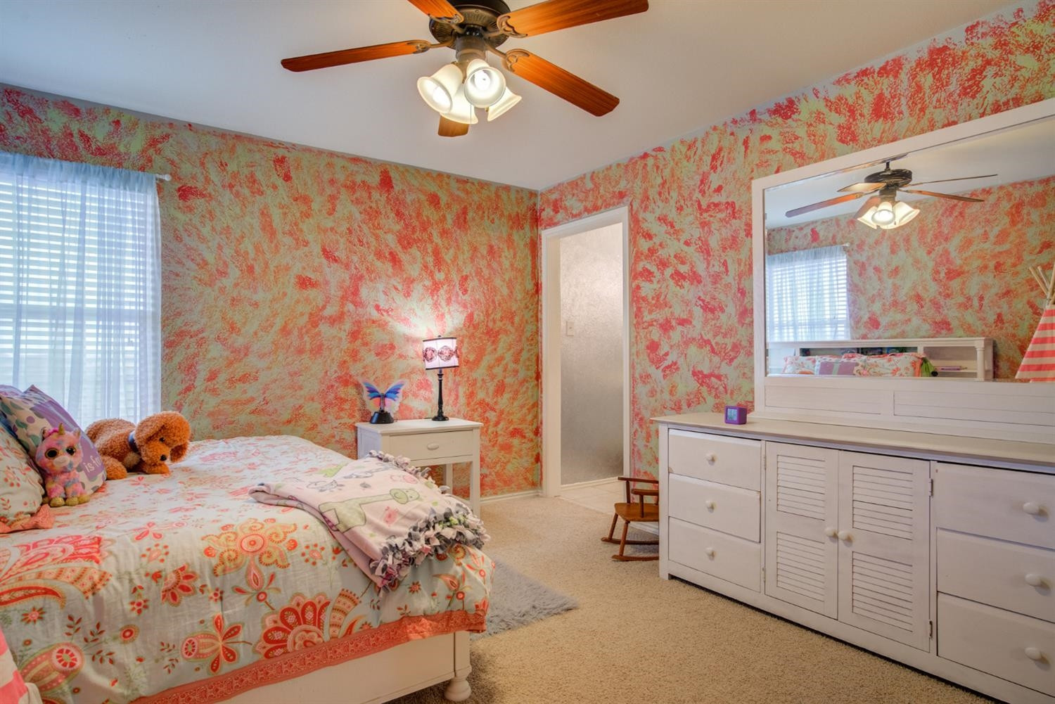 5904 110th Street Lubbock, TX 79424 - Photo 40 of 50 a bedroom with a bed and a chandelier