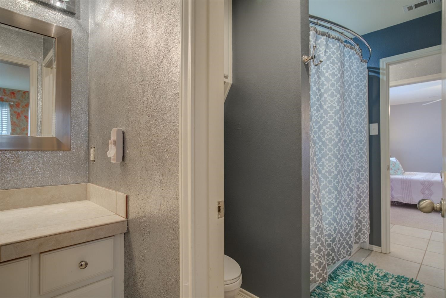 5904 110th Street Lubbock, TX 79424 - Photo 42 of 50 a bathroom with a shower and a sink