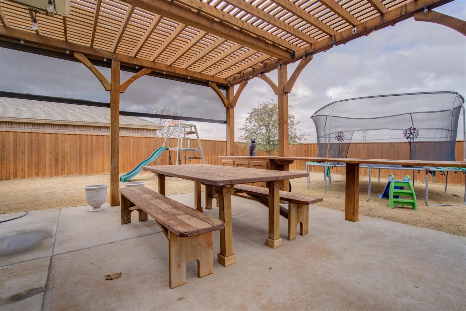 5904 110th Street Lubbock, TX 79424 - Photo 48 of 50 a view of a roof deck with wooden fence