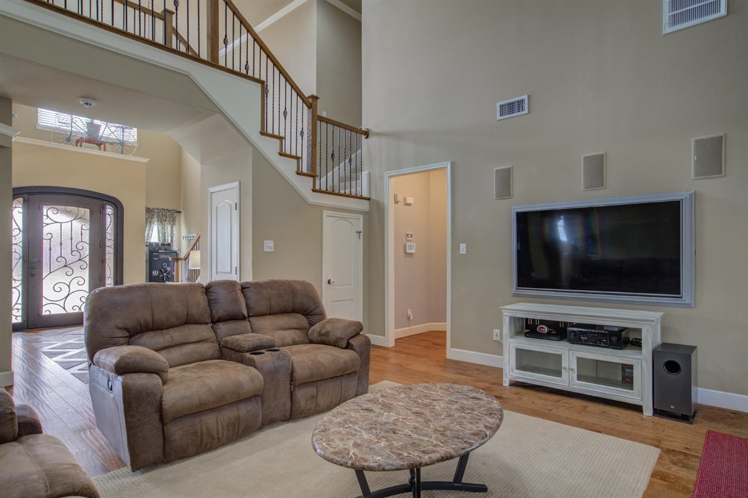 5904 110th Street Lubbock, TX 79424 - Photo 9 of 50 a living room with furniture and a flat screen tv