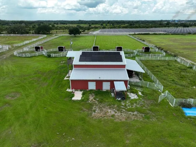a view of a yard with an outdoor seating