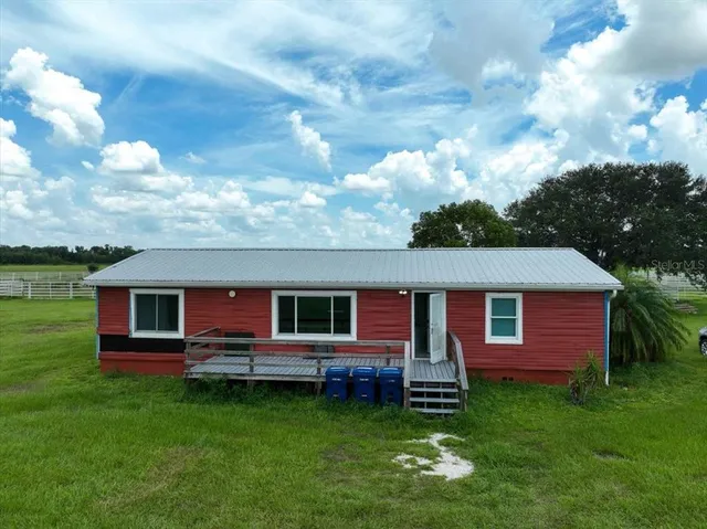 a view of a pool in a backyard