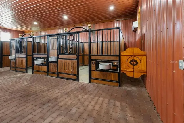 a childrens park with lots of swings slides and swimming pool