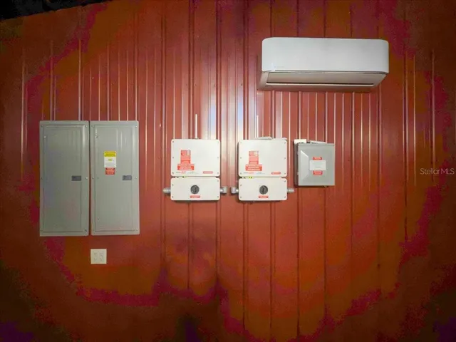 a kitchen with stainless steel appliances granite countertop a stove top oven a sink dishwasher and a refrigerator with wooden floor