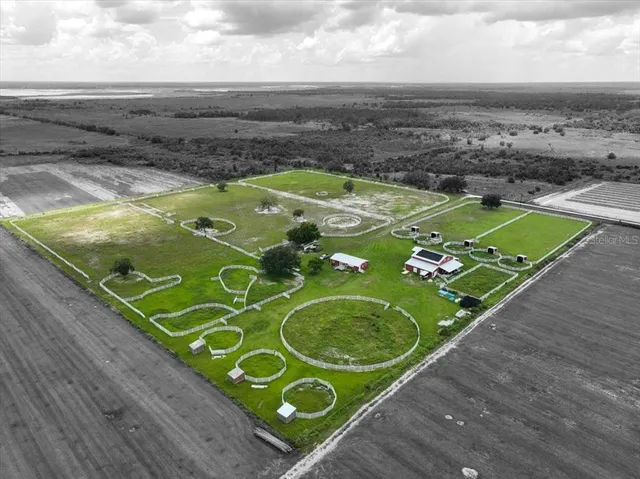 a view of a pool in a backyard