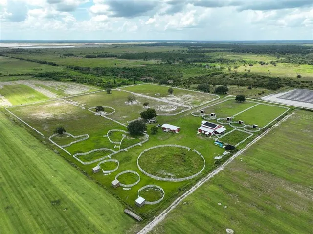 a view of a big yard with table and chairs
