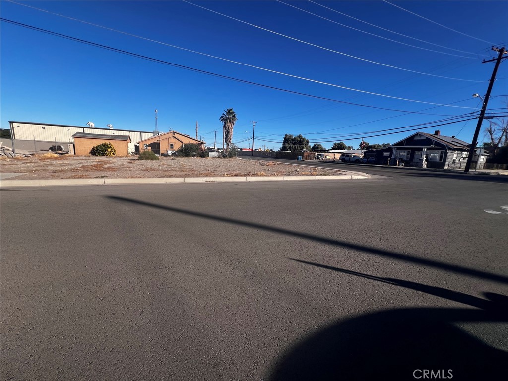 521 Quivera Street Needles, CA 92363 - Photo 4 of 17 a view of car parked on the street