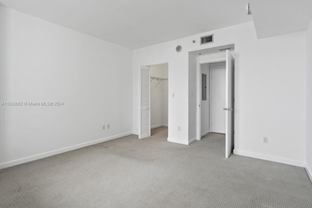 325 South Biscayne Boulevard, Unit 2118 Miami, FL 33131 - Photo 17 of 22 an empty room with closet