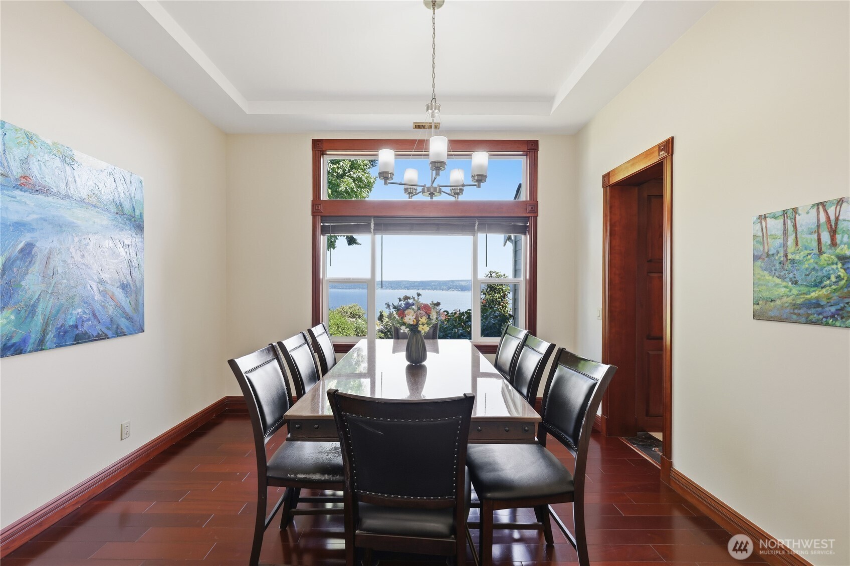 1411 Thorndyke Road Port Ludlow, WA 98365 - Photo 12 of 40 a dining room with furniture a chandelier and wooden floor
