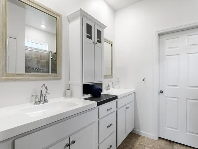 a bathroom with a sink and a mirror
