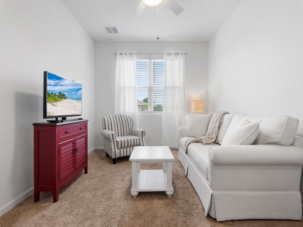 2040 Amazon Way Southwest Vero Beach, FL 32962 - Photo 14 of 35 a living room with furniture and a window