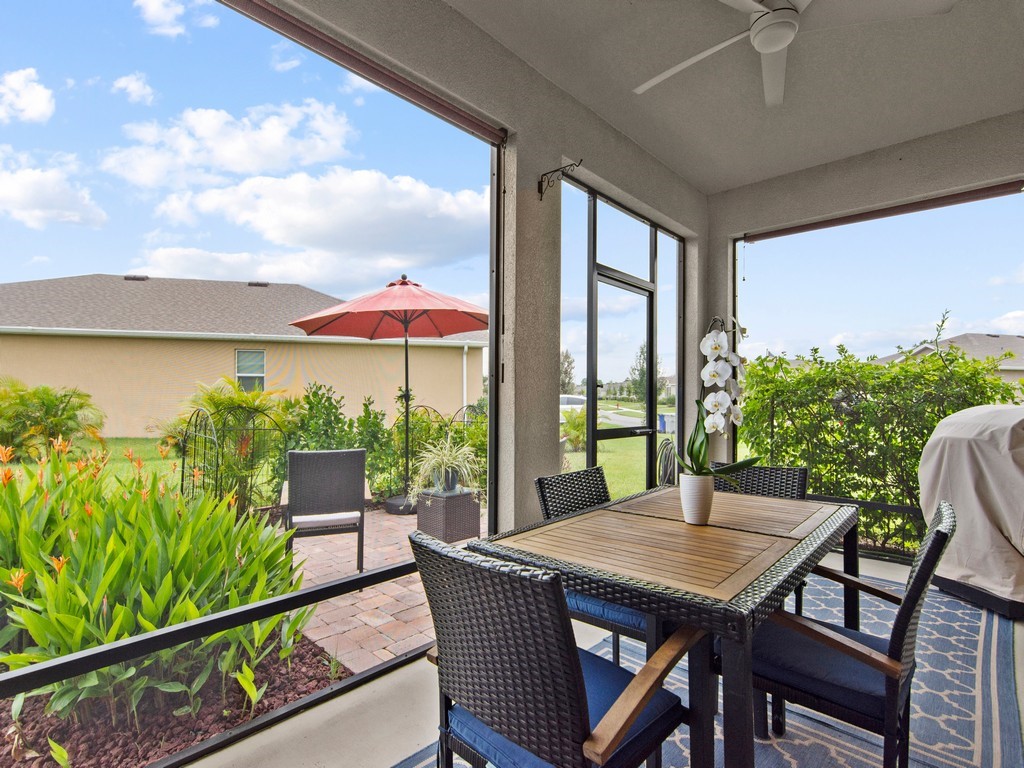 2040 Amazon Way Southwest Vero Beach, FL 32962 - Photo 19 of 35 a view of balcony with furniture and garden