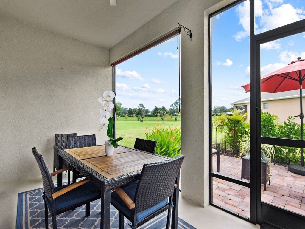 2040 Amazon Way Southwest Vero Beach, FL 32962 - Photo 20 of 35 a view of a dining room with furniture and a potted plant