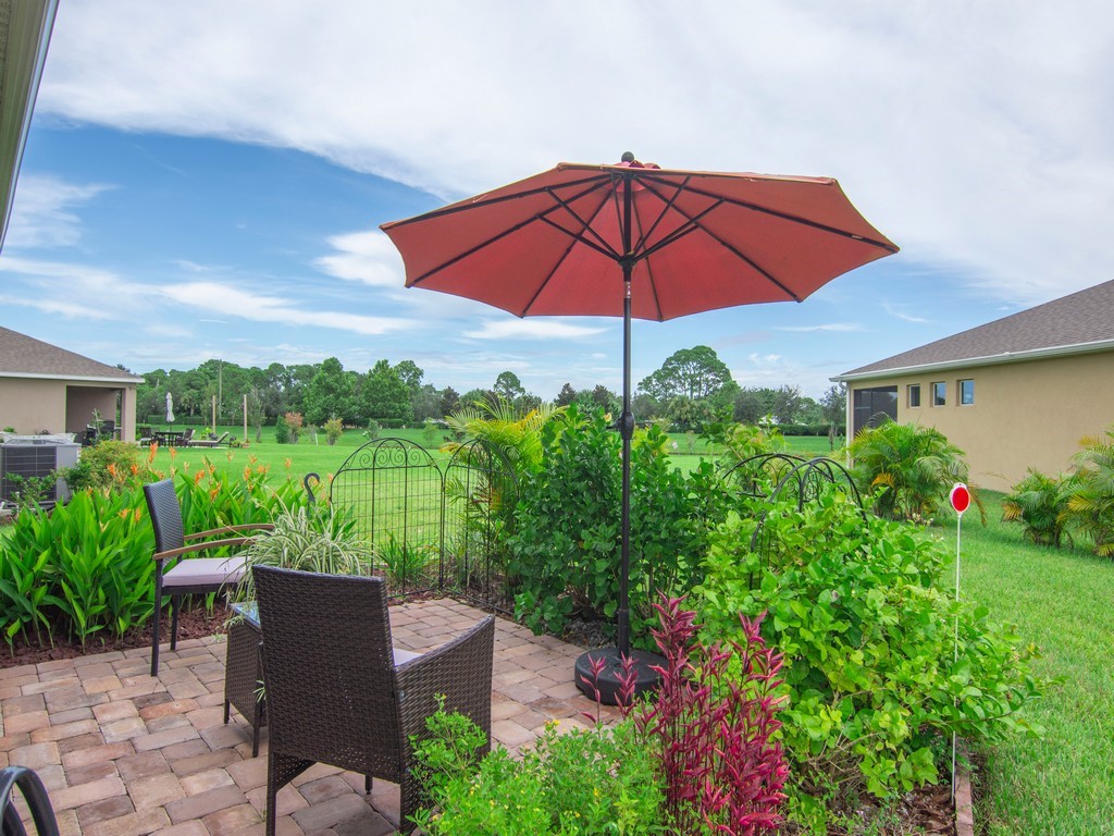 2040 Amazon Way Southwest Vero Beach, FL 32962 - Photo 21 of 35 a view of a chair and table in the garden