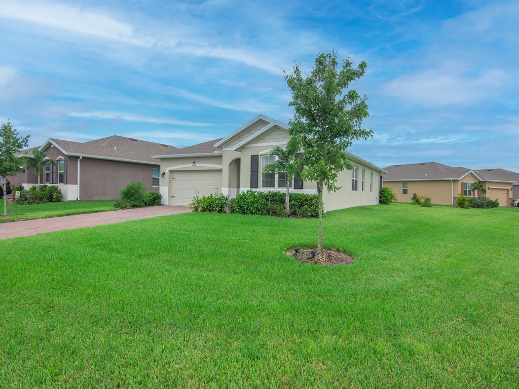 2040 Amazon Way Southwest Vero Beach, FL 32962 - Photo 25 of 35 a front view of house with yard