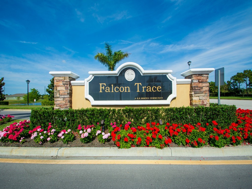 2040 Amazon Way Southwest Vero Beach, FL 32962 - Photo 28 of 35 a street sign that is sitting in front of flowers