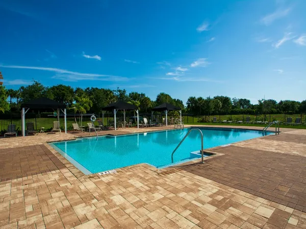 a view of a swimming pool with a yard