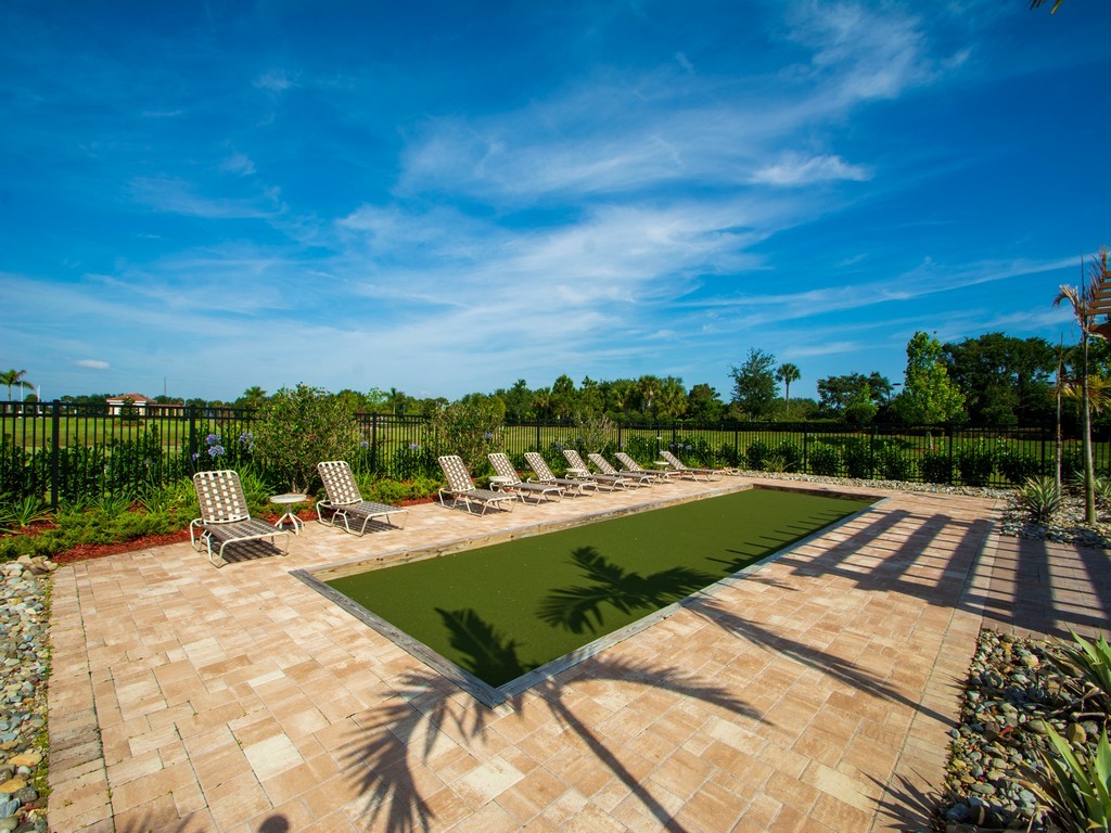 2040 Amazon Way Southwest Vero Beach, FL 32962 - Photo 31 of 35 a view of a swimming pool with a yard