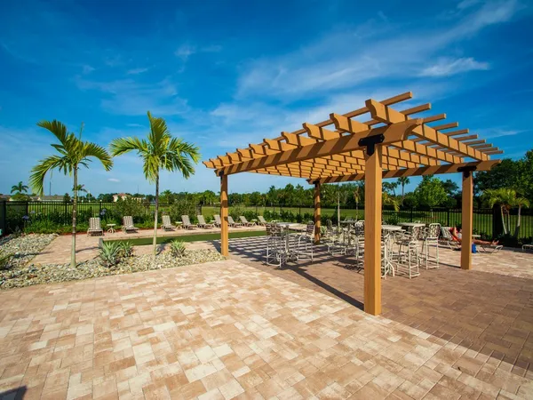 a view of a swimming pool with an outdoor seating